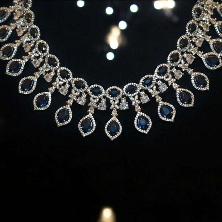 Elegant Rhodium-Plated Necklace with Clustered AD, CZ & Blue Stones