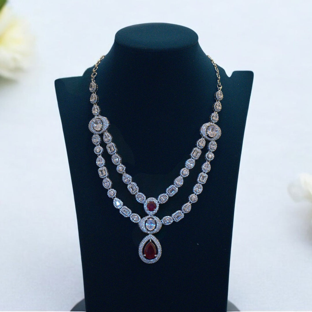 Elegant Rhodium-Plated Necklace with Clustered AD, CZ & Ruby Red Stones