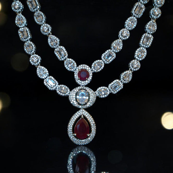 Elegant Rhodium-Plated Necklace with Clustered AD, CZ & Ruby Red Stones